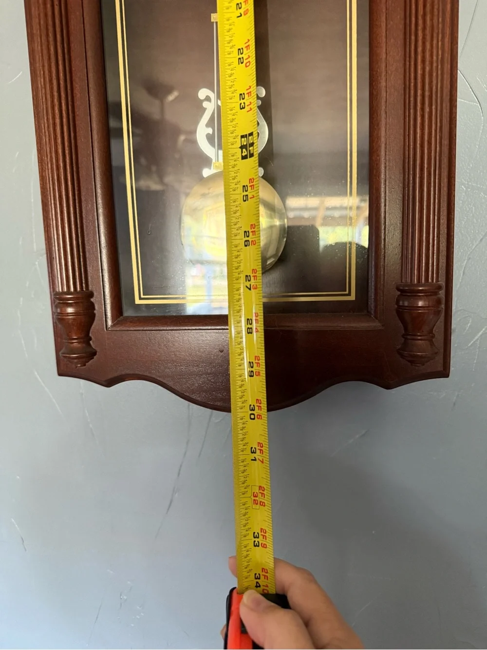 Howard Miller Wall Pendulum Clock in Rich Mahogany